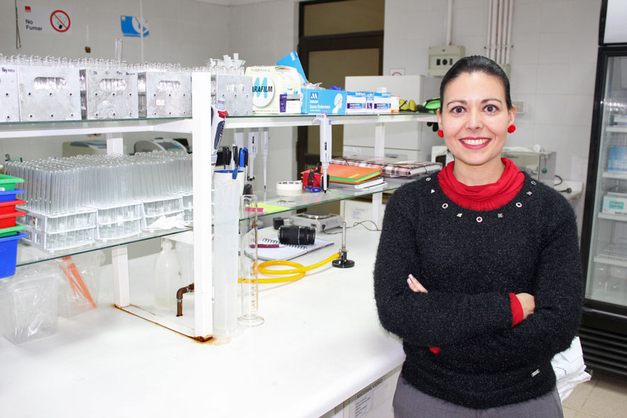 Chris standing up holding his daughter Elva